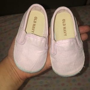 Pink and white baby soft shoes.